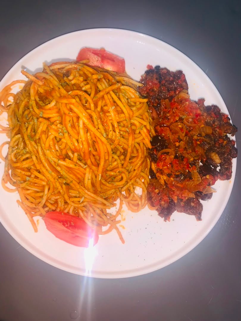 Jollof spaghetti and peppered beef